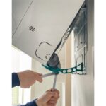 Bec ajusteur de déflecteurs pour grille ventilation, configuration visible, vue complémentaire 1