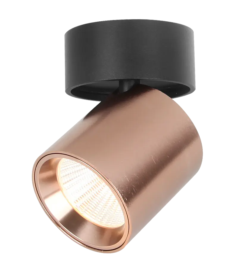 Fantasia Oyo spot orientable finition bronze et noir Spot cylindrique bronze incliné sous une base ronde noire avec réflecteur visible