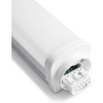Extrémité ouverte d’un luminaire blanc montrant le bornier et les connexions internes